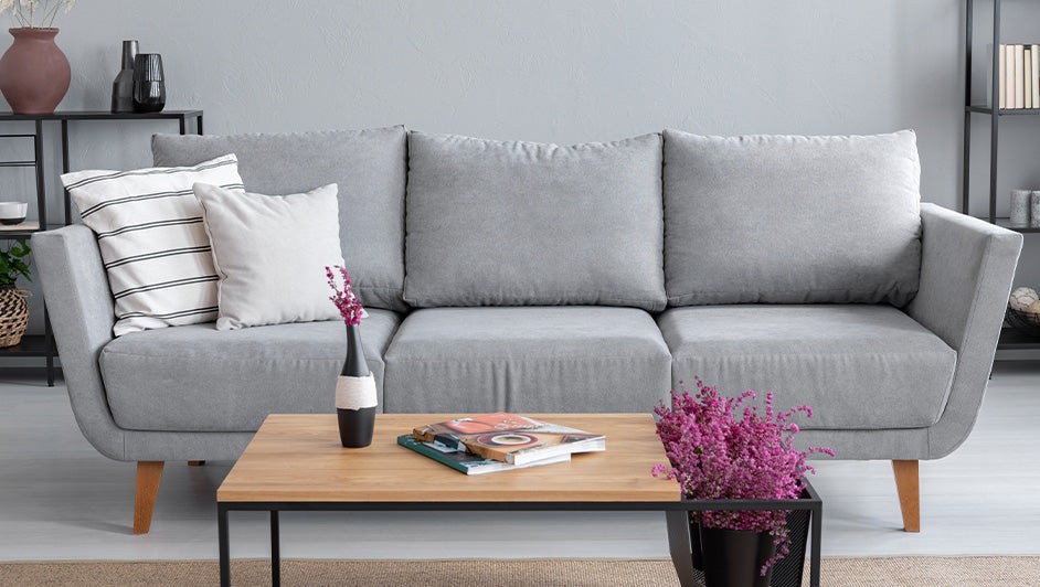 Modern grey fabric sofa styled in contemporary living room